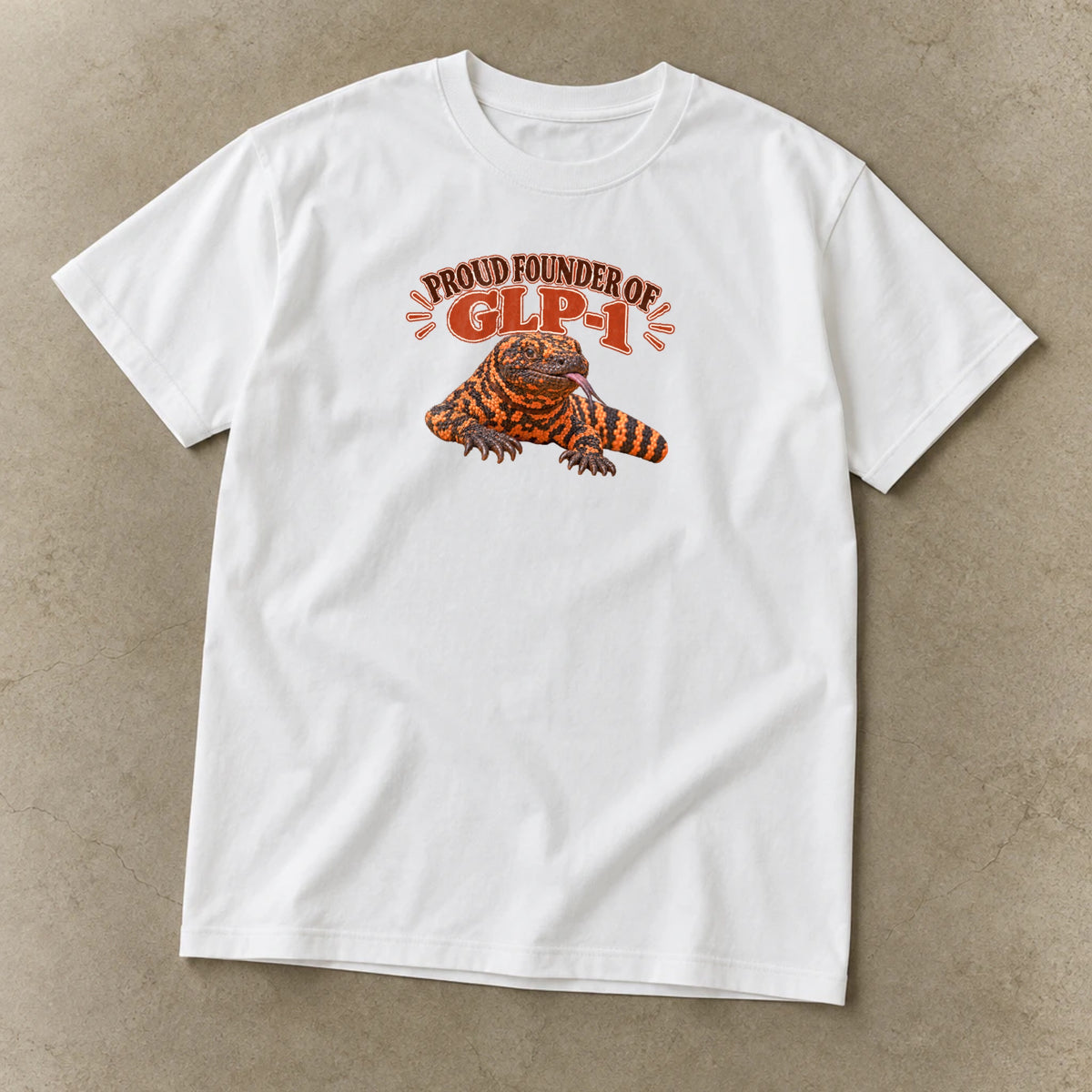 Proud Founder of GLP-1 T-Shirt, garment-dyed unisex tee laid flat